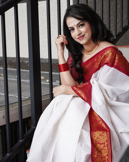 Traditional red and white Madurai Sungudi cotton saree