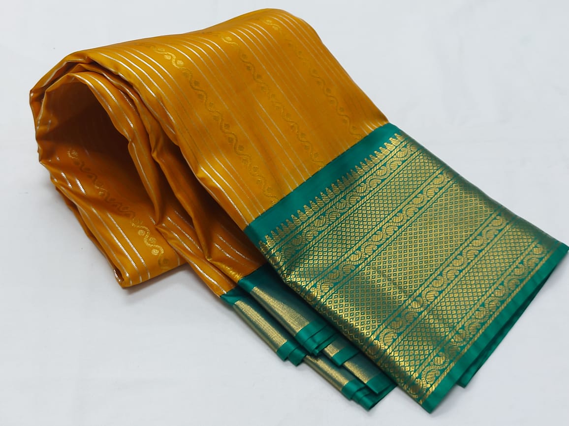Oragne with green pattu saree