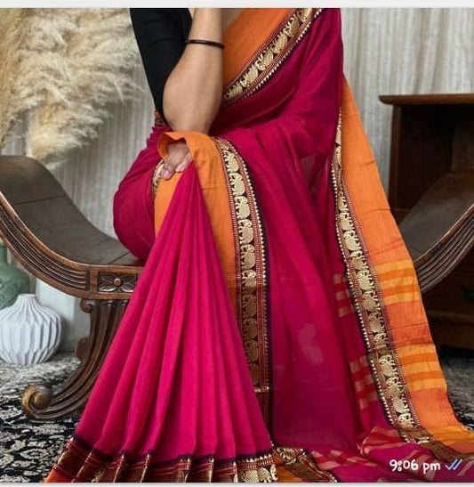 A close-up of a dark pink and orange pure Narayanpeth mercerised cotton saree with a traditional border, displayed on a model.
