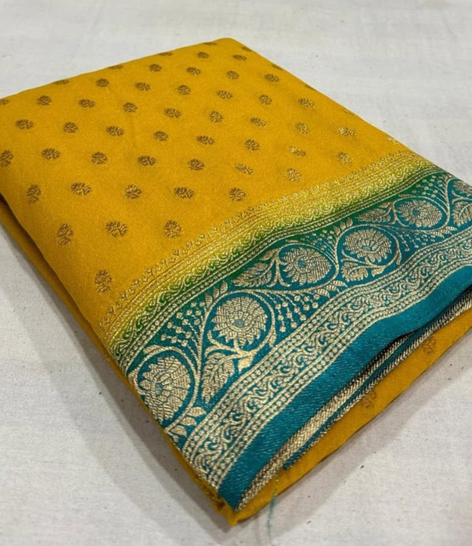 Yellow saree with green and gold border on a white background