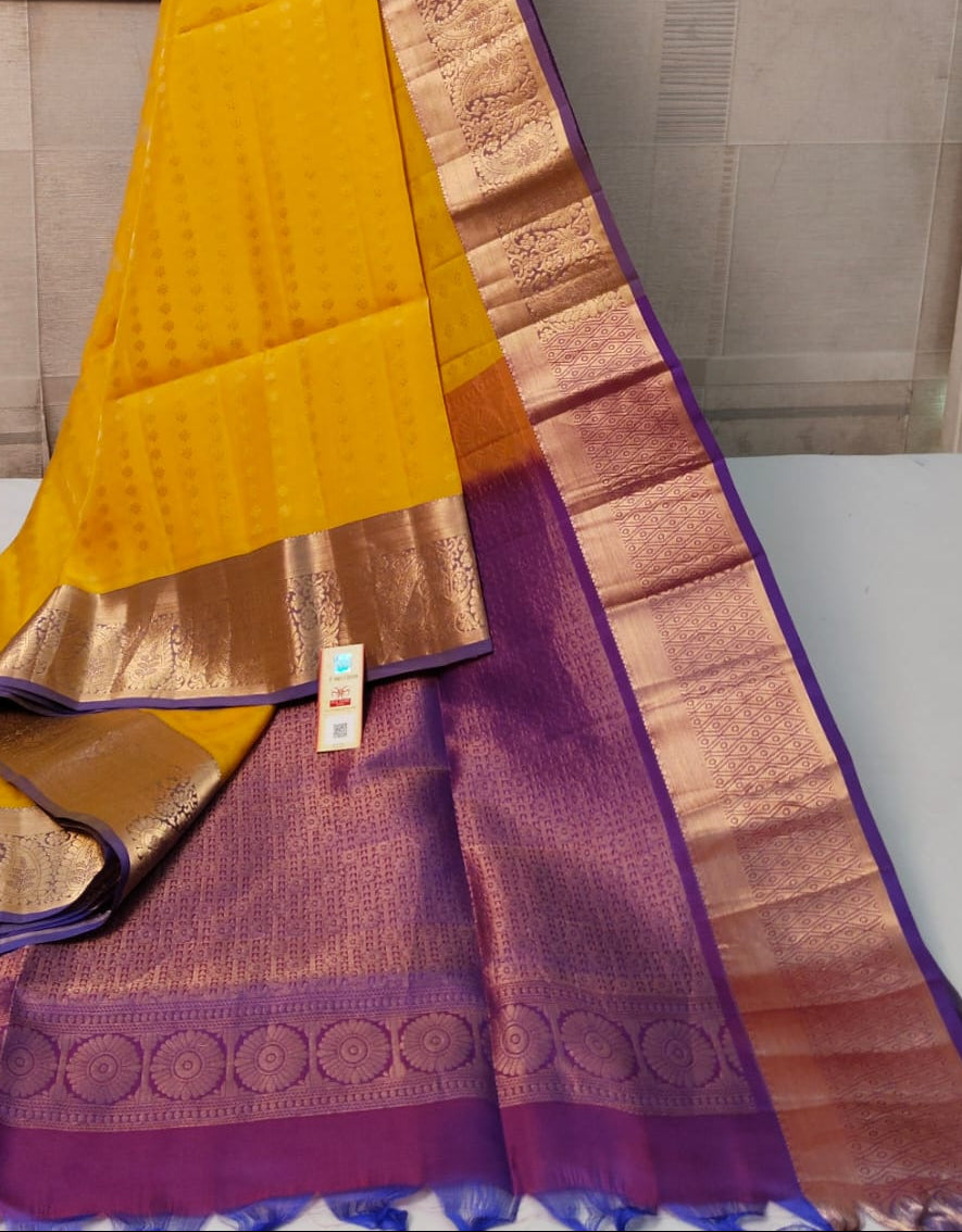Yellow and purple saree with a brand logo in the background