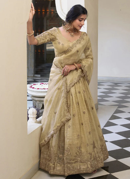 cream-colored lehenga choli with a matching dupatta
