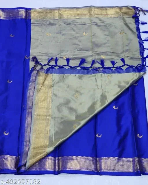 Blue and green saree with decorative border on a white background