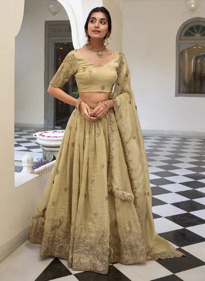 cream-colored lehenga choli with a matching dupatta