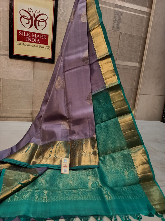 Lavish purple with turquoise kanchipuram saree