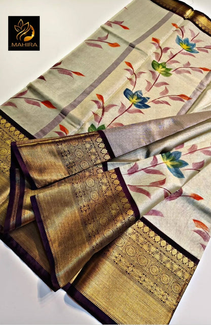 Saree with floral patterns and gold accents on a light background