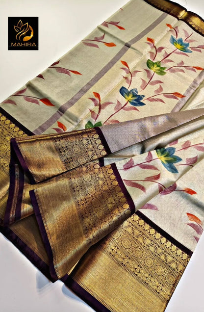 Saree with floral patterns and gold accents on a light background