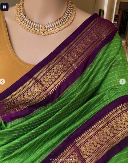 Kalyani cotton check saree – green purple with gold border