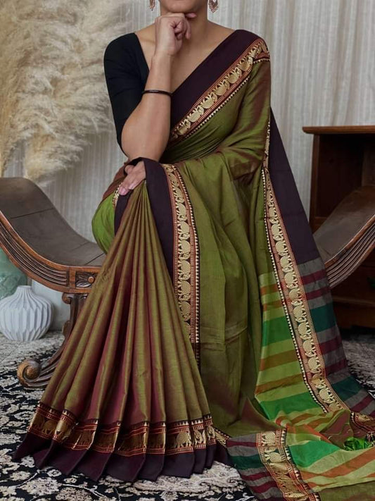 A woman modeling a Narayanpeth Mercerised Cotton Saree with a traditional border design in green, black, and multicolor.