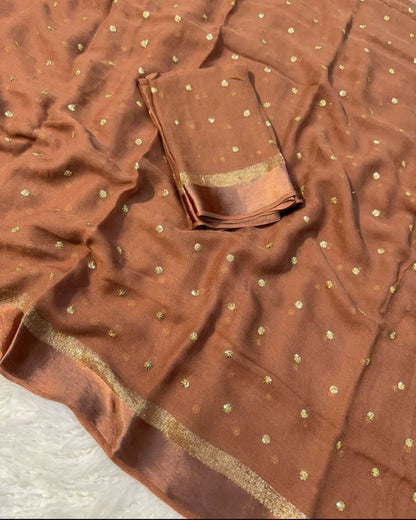 Brown fabric with gold patterns and border