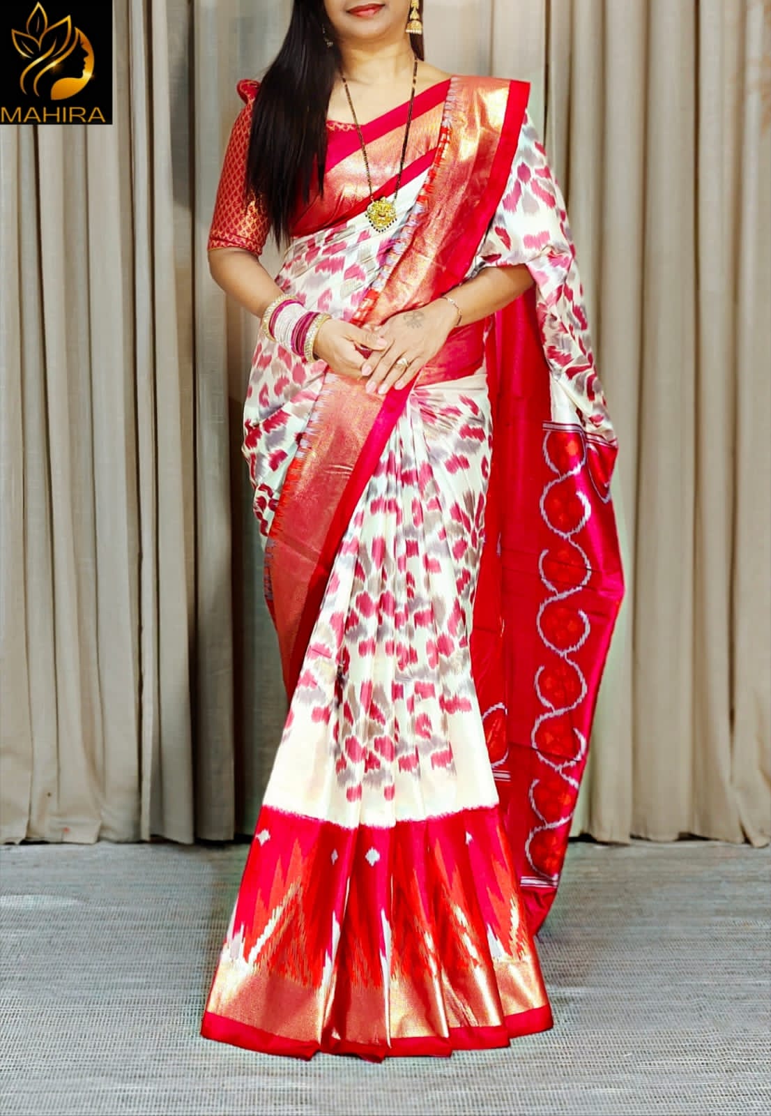 Ikkath style design dola silk saree in red an off white