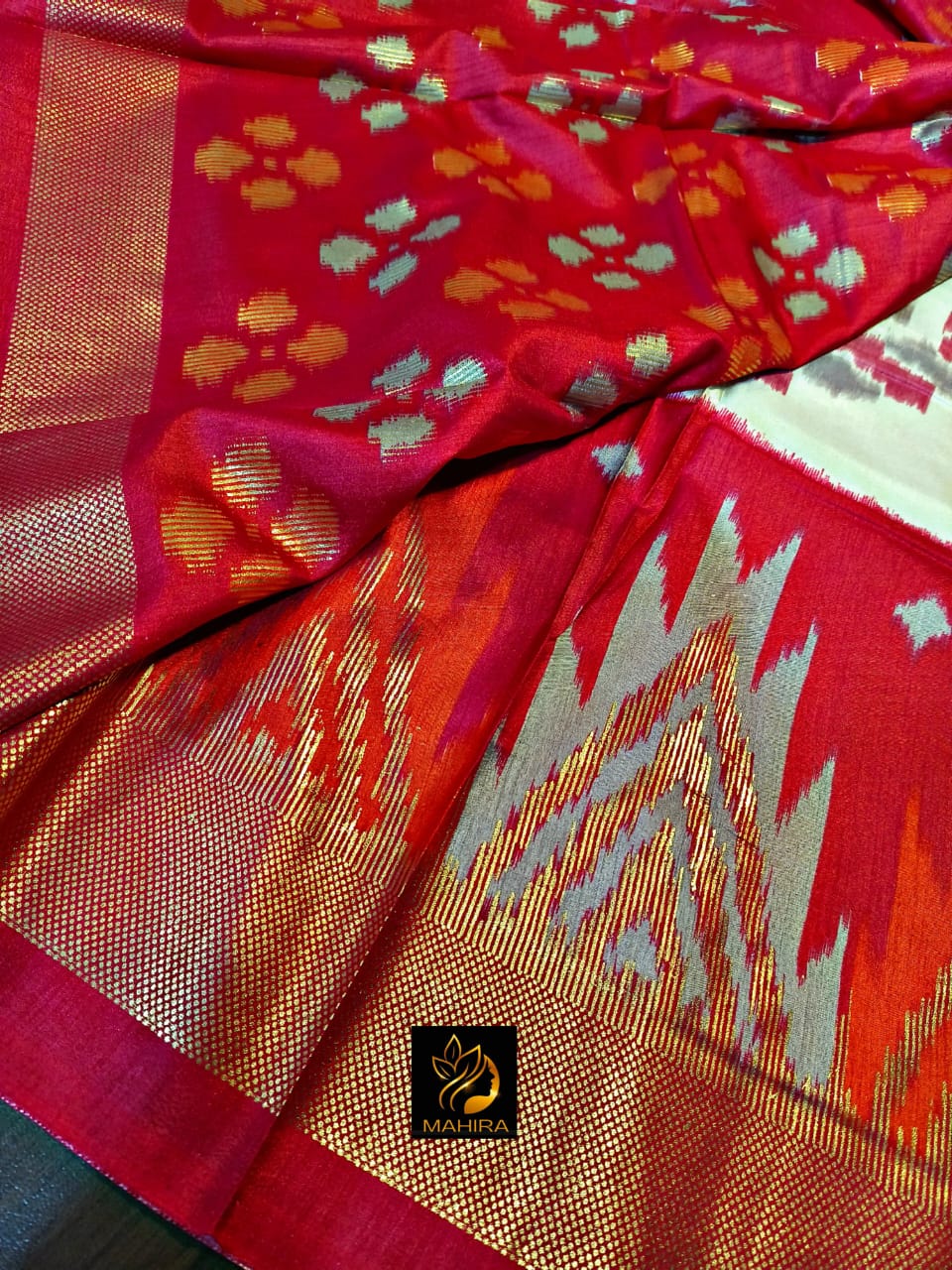 Ikkath style design dola silk saree in red an off white