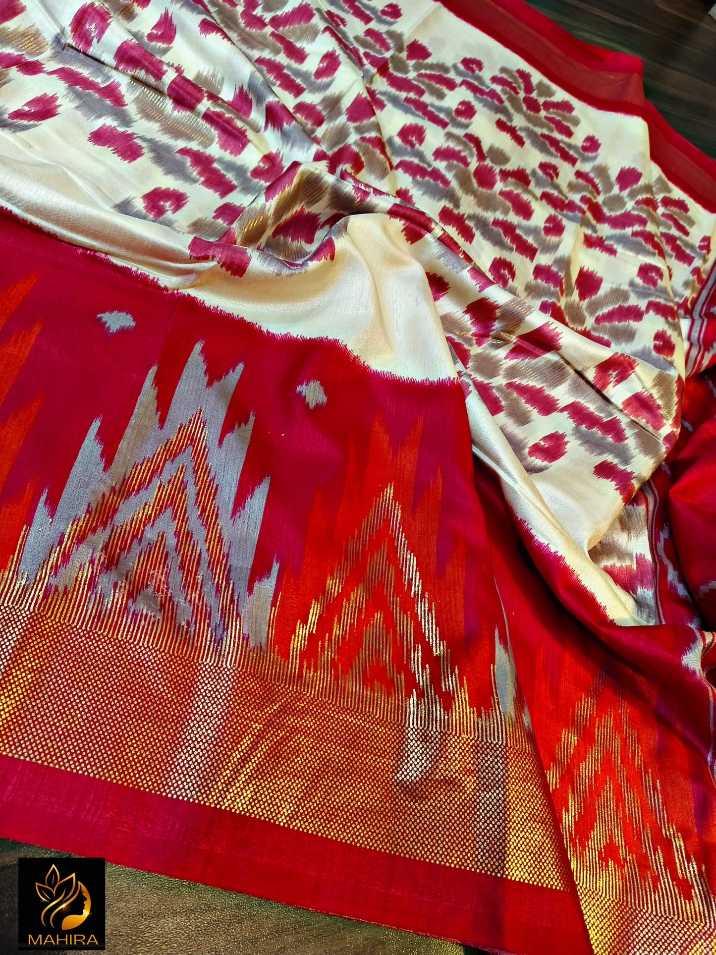 Ikkath style design dola silk saree in red an off white