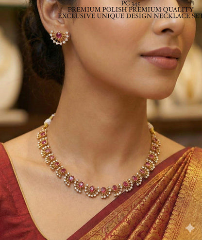 Woman wearing a gold and pink necklace with a blurred background