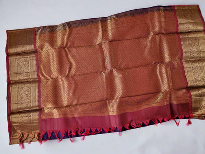 Brown and gold patterned fabric with red accents on a white background