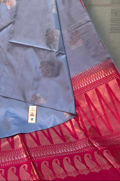 Blue and red saree with a brand logo in the background