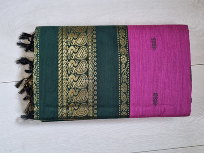 Sari with green and purple design on a white background