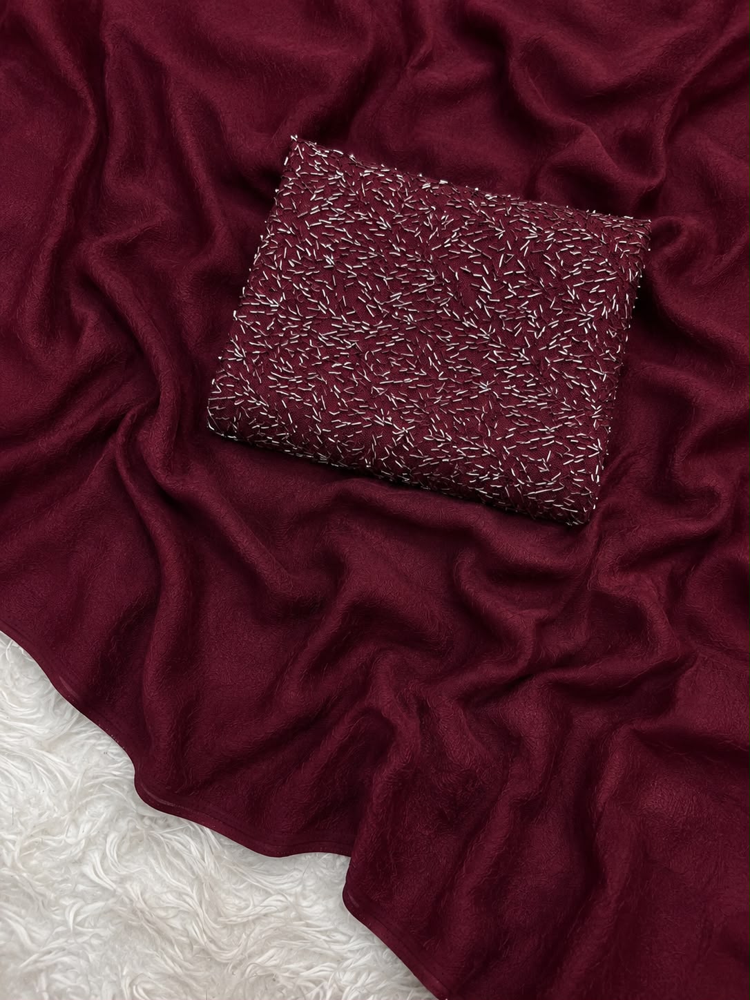Burgundy saree with silver sequin work and matching blouse piece