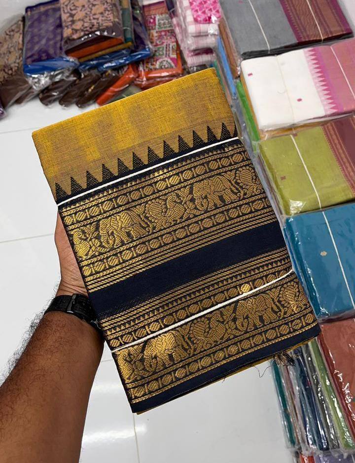 Mustard Kanchi cotton saree with black and gold traditional woven border