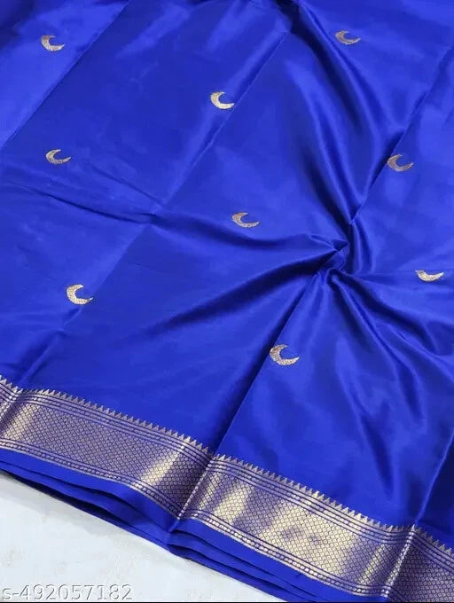 Blue fabric with gold crescent moon patterns on a white background